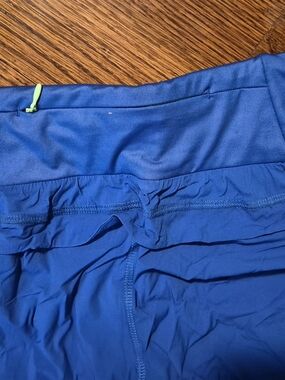 Blue Athletic Leggings with Lime Zipper Pull